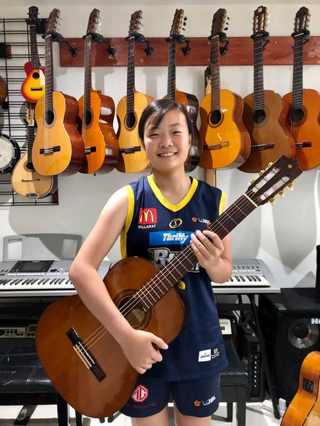 Anne, 13 year old prodigy with a 1978 Yamaha G-225 Custom electric classical guitar