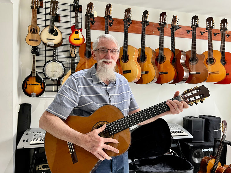 Frank with a Takamine No.5 (1990) classical guitar