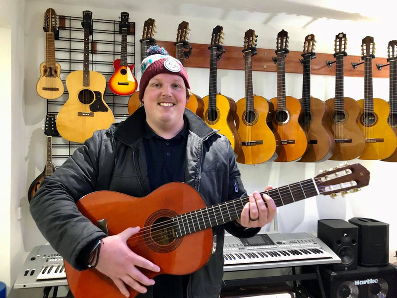 Darren with a Yamaha electric/acoustic classical guitar