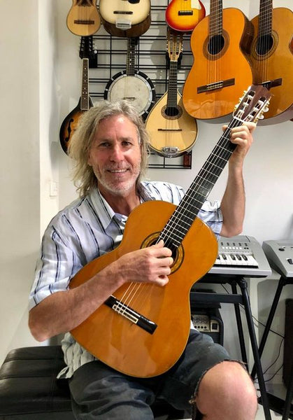Grant wore his lucky shirt when he finally found this beautiful Takamine No.5 classical guitar. A match made in musical heaven
