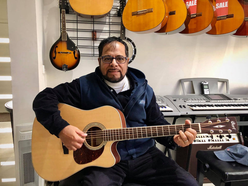 Pepe from El Salvador, he's the best mariachi singer I've ever met. It's his new Cort guitar.