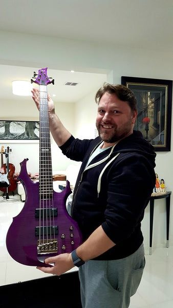 Another happy customer. Robbie with his new heavy metal 5 string bass guitar. Rock on !!!!!!