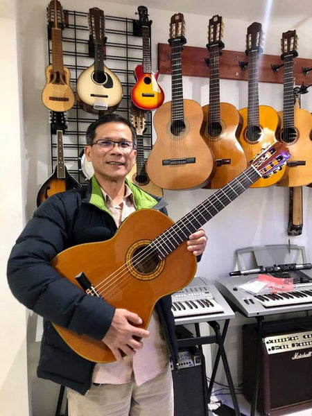 Mr. Tung with his new 1970s Takamine no.30 classical guitar. This beaut is going on his private yatch
